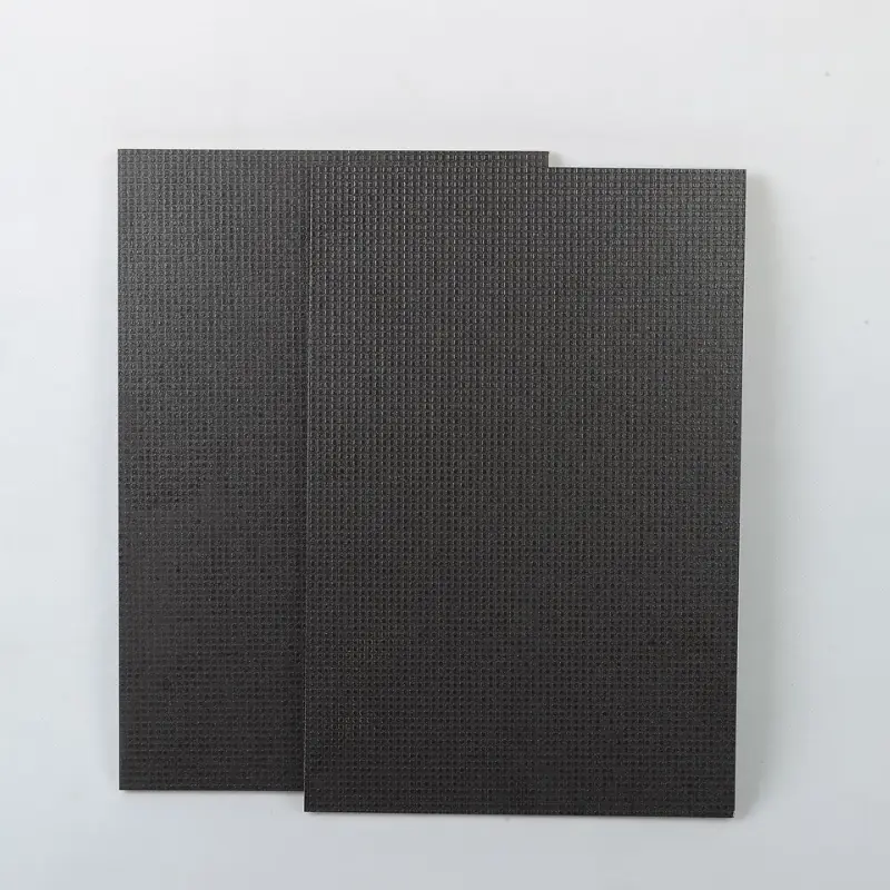 Anti-slip film faced plywood with textured surface for construction and flooring applications.
